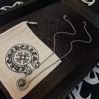 Chrome Accessories necklace set with pendant and chain, shown with pouch and box.