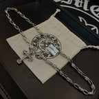 Silver cross pendant necklace with pouch and linked chain detail