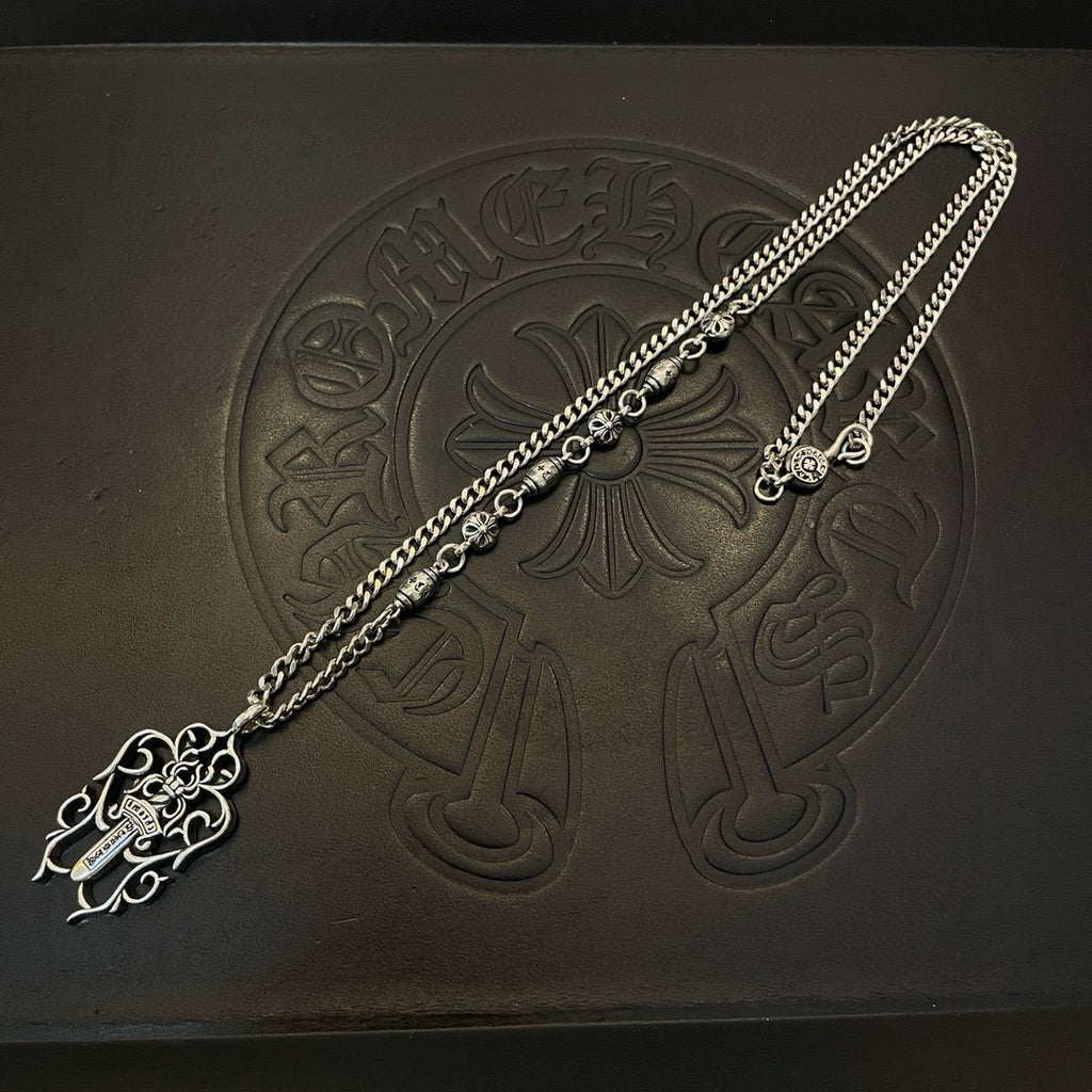 Silver-tone chain necklace chain with round charm and cross pendant detail