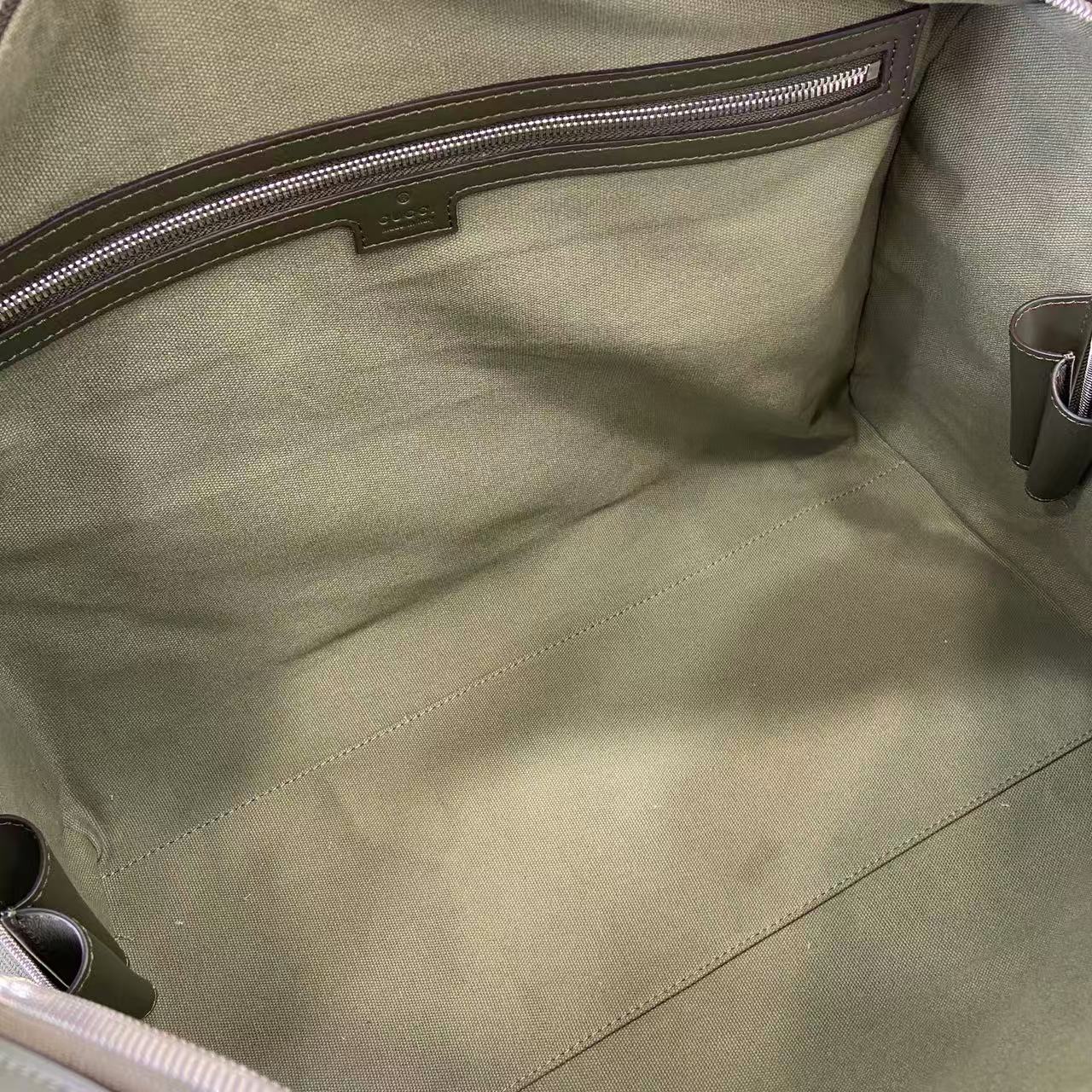 Gucci bag interior lining with stitched pocket panel and metal zipper pull