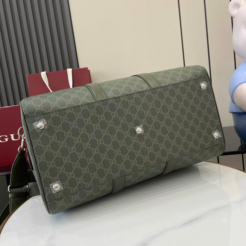 Gucci duffel bag in dark green GG canvas with stud feet and reinforced top seam
