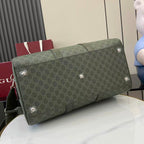 Gucci duffel bag in dark green GG canvas with stud feet and reinforced top seam