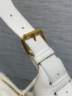 White leather strap with gold buckle and ring hardware