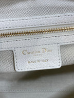 Christian Dior Paris made in Italy label on white leather bag