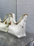 Dior white quilted leather shoulder bag with gold hardware and adjustable strap