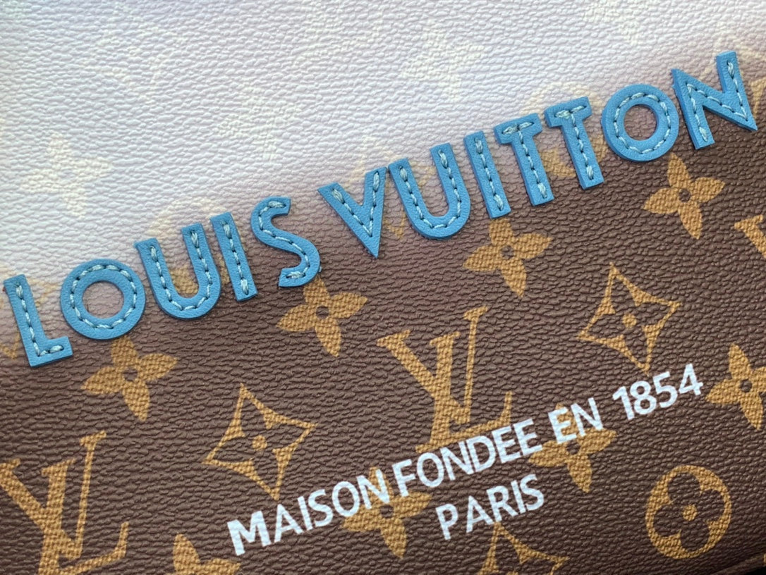 Louis Vuitton monogram handbag text detail on brown canvas with blue lettering