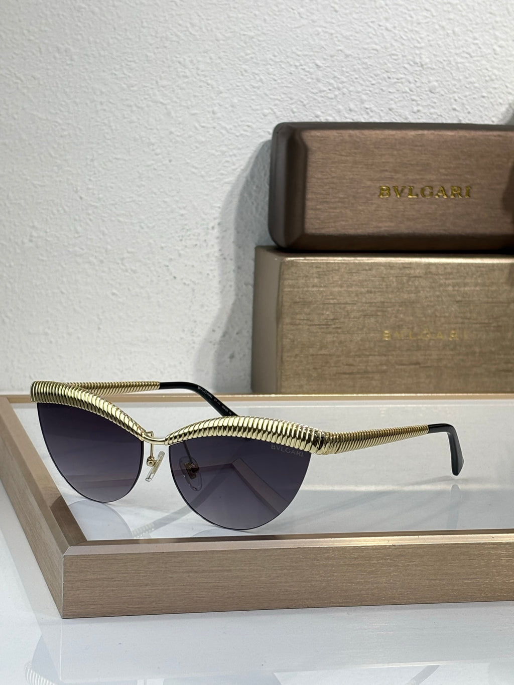 Bvlgari sunglasses with gold wireframe and dark tinted round lenses