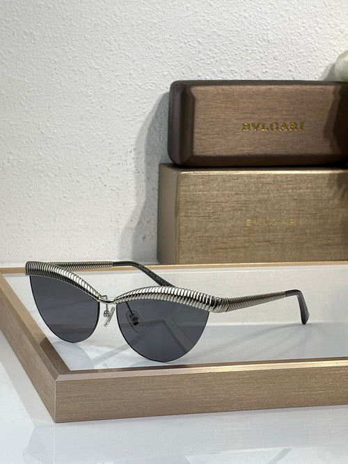 Bvlgari sunglasses with gold wireframe and dark tinted round lenses