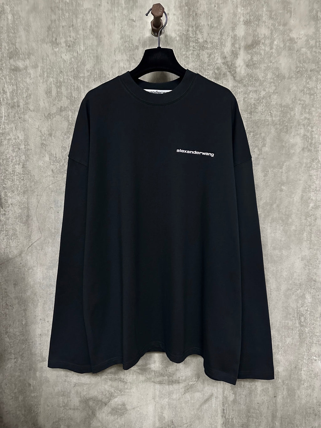 Black long-sleeve crewneck shirt with alexanderwang chest logo