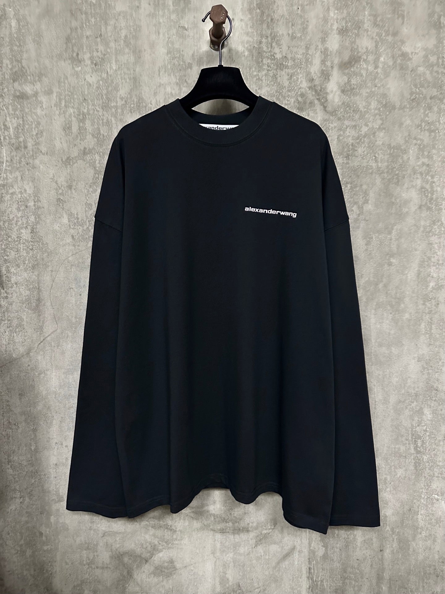 Black long-sleeve crewneck shirt with alexanderwang chest logo