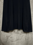 Black long-sleeve crewneck shirt with curved hem and stitched cuffs
