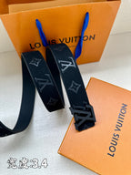 Leather belt with dark monogram strap and oversized metal buckle, on box