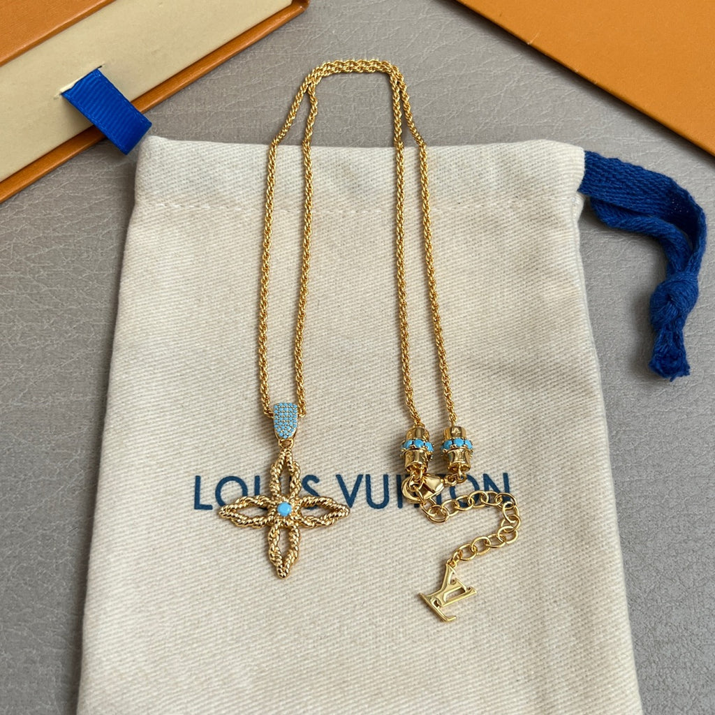 Gold chain double necklace with butterfly pendants and small key charm; white pouch