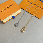 Silver and gold cat-head charm necklaces with gift boxes
