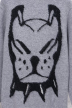 Gray knit sweater close-up of black cartoon animal face graphic