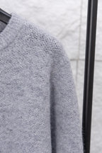 Gray knit sweater sleeve knit close-up