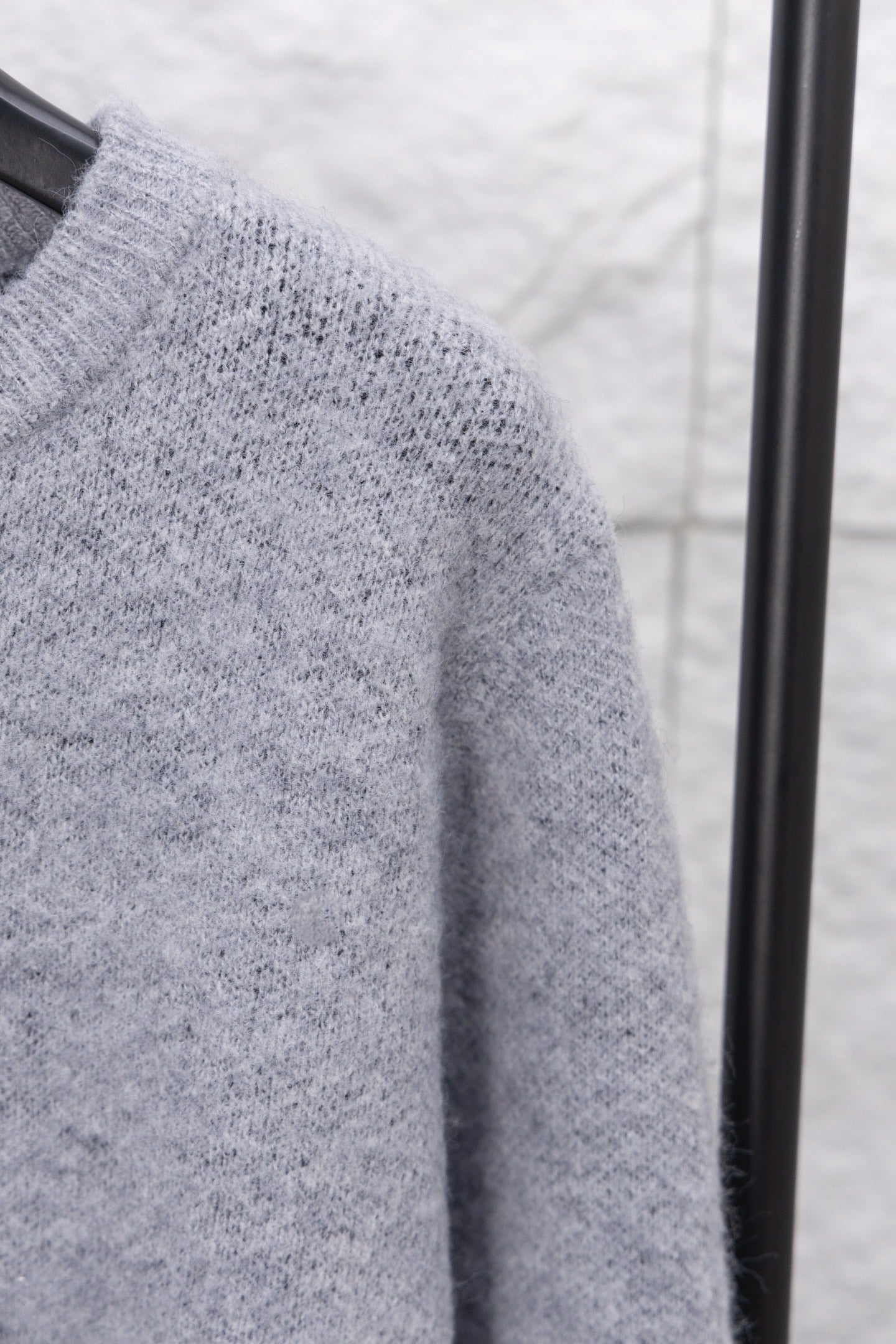 Gray knit sweater sleeve knit close-up
