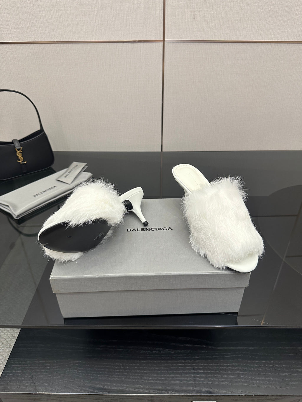 White faux-fur slide sandals, side profile with low heel