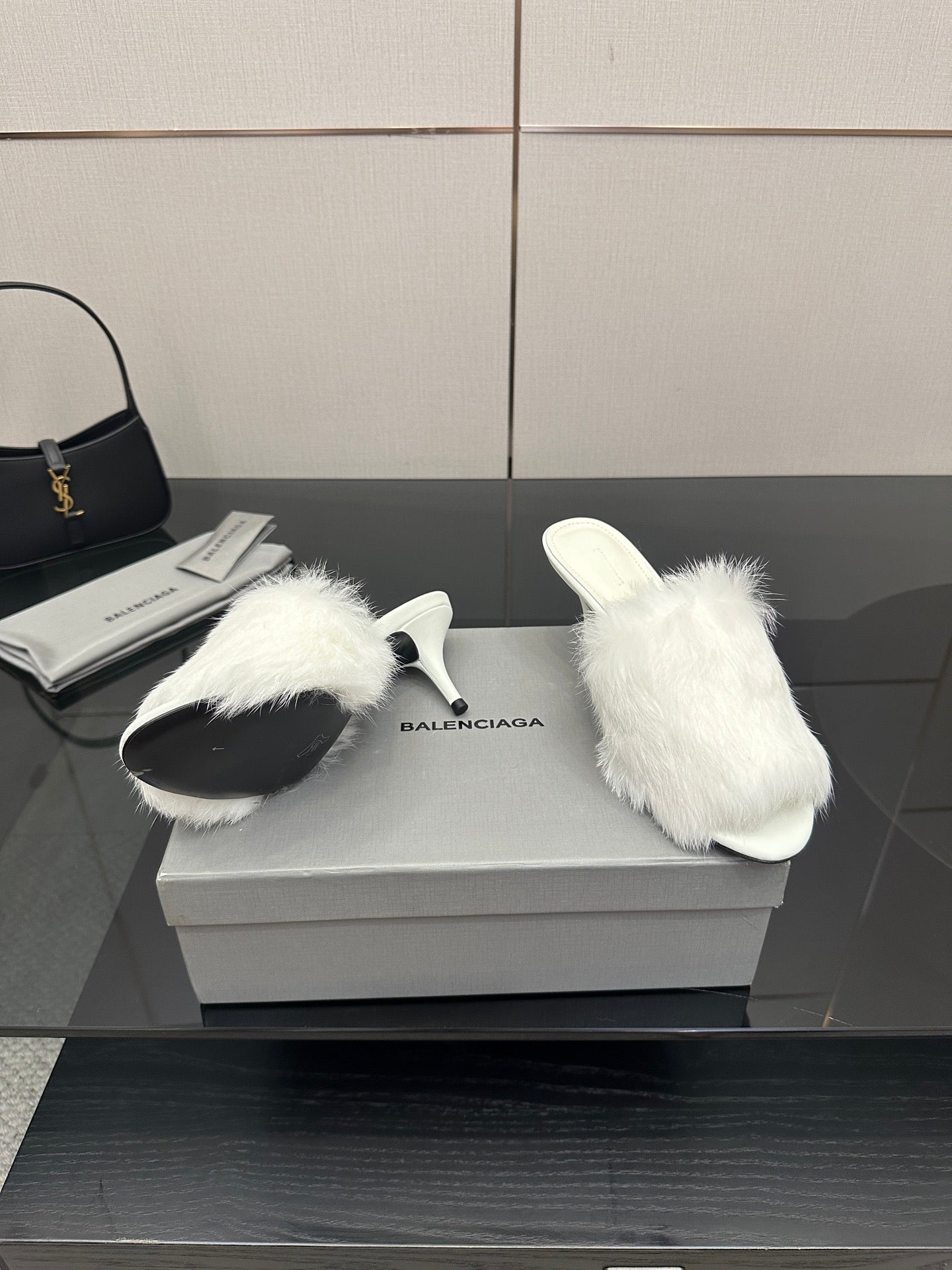 White faux-fur slide sandals, side profile with low heel