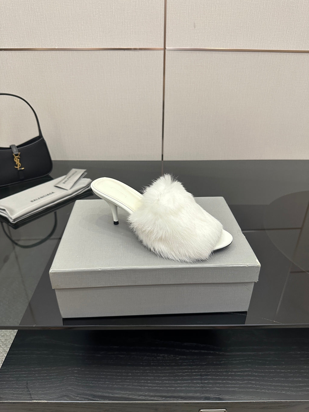 White faux-fur slide sandal with low heel, angled side view