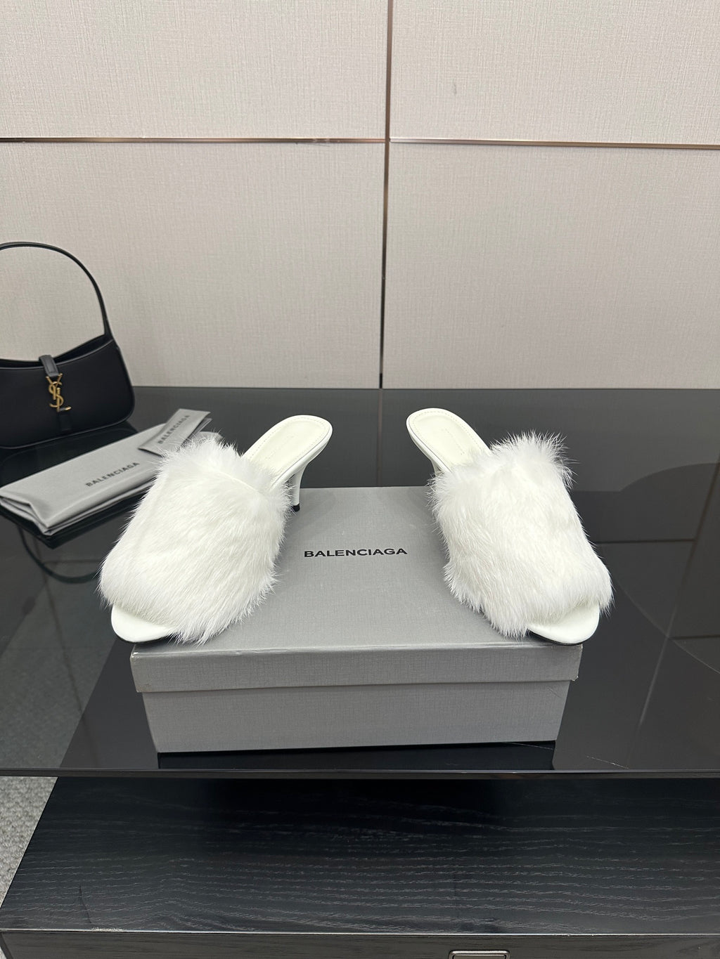 White faux-fur slide sandals, front view with low heel