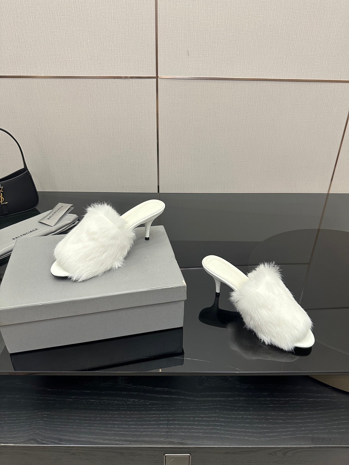 White faux-fur slide sandals, pair on display with low heel