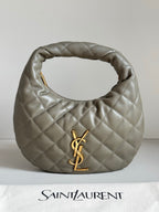 Quilted hobo bag in metallic gray with gold YSL logo and top loop handle