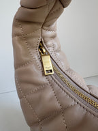 YSL quilted hobo bag close-up of gold zipper pull and top zip pocket