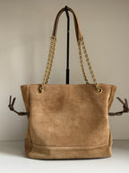 Tan suede tote bag with gold chain shoulder straps and top handles, front view