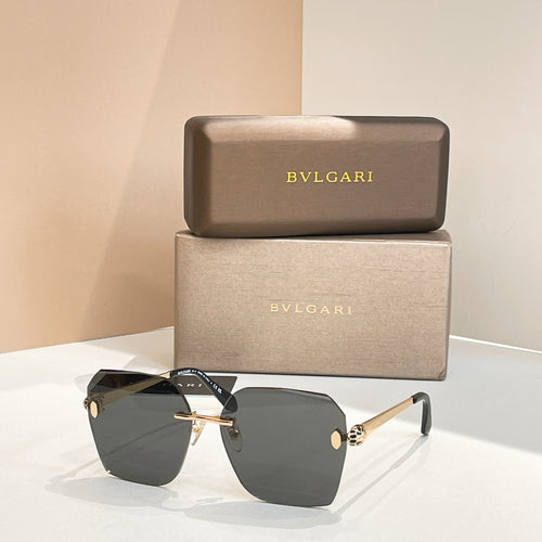 Bvlgari oversized sunglasses with dark gray gradient lenses and black frame, gold accents