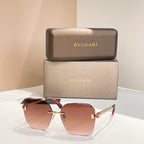 Bvlgari cat-eye sunglasses with light pink gradient lenses and rose-gold frame