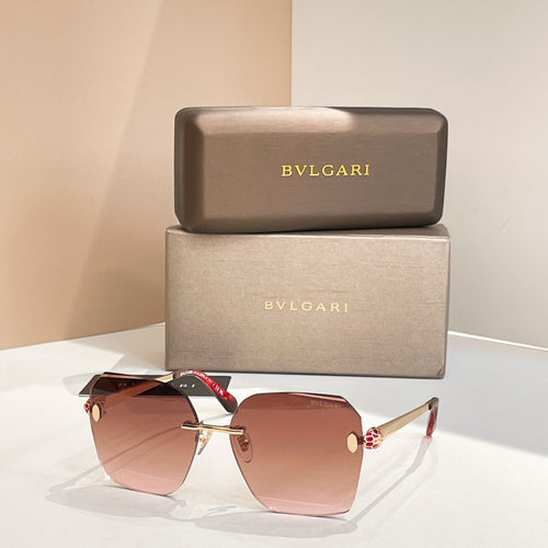 Bvlgari cat-eye sunglasses with light pink gradient lenses and rose-gold frame