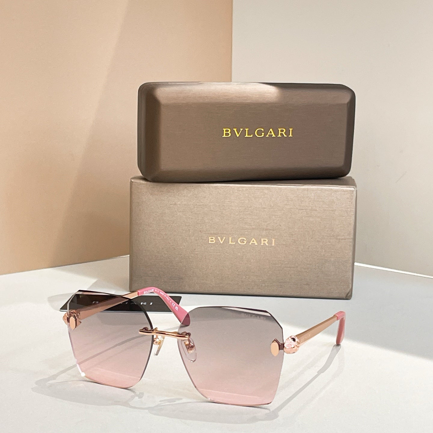 Bvlgari oversized sunglasses with blush gradient lenses and black frame, pink temples