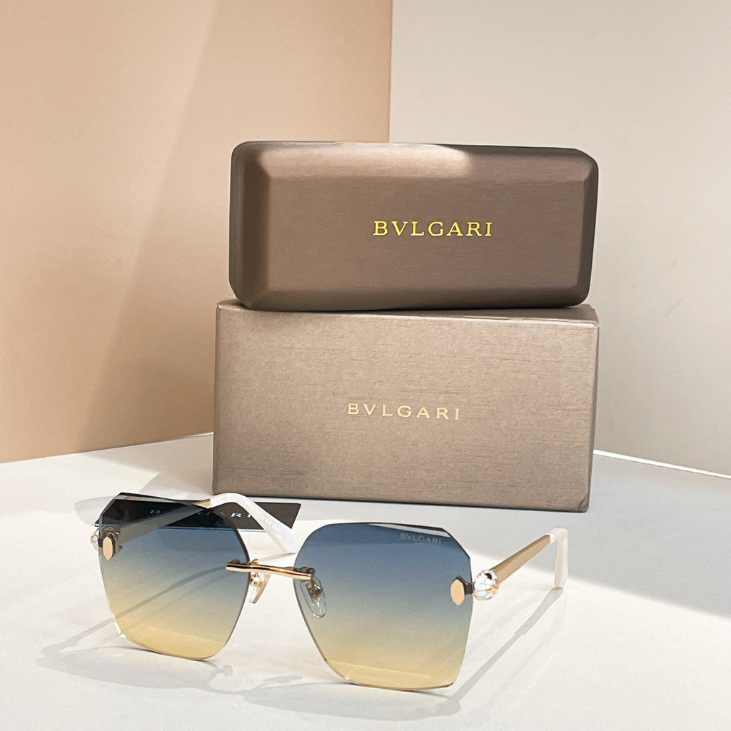 Bvlgari oversized sunglasses with blue gradient lenses and gold bridge, black temples