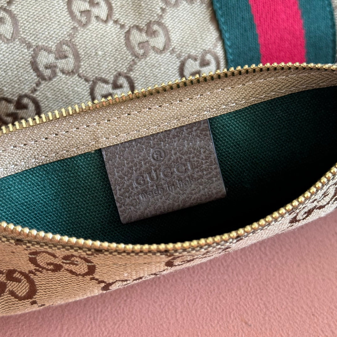 Gucci GG tote bag interior lining with zip pocket label and gold zipper