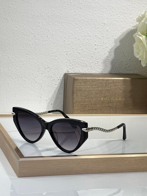 Bvlgari sunglasses with black frames, dark lenses, and braided gold temples