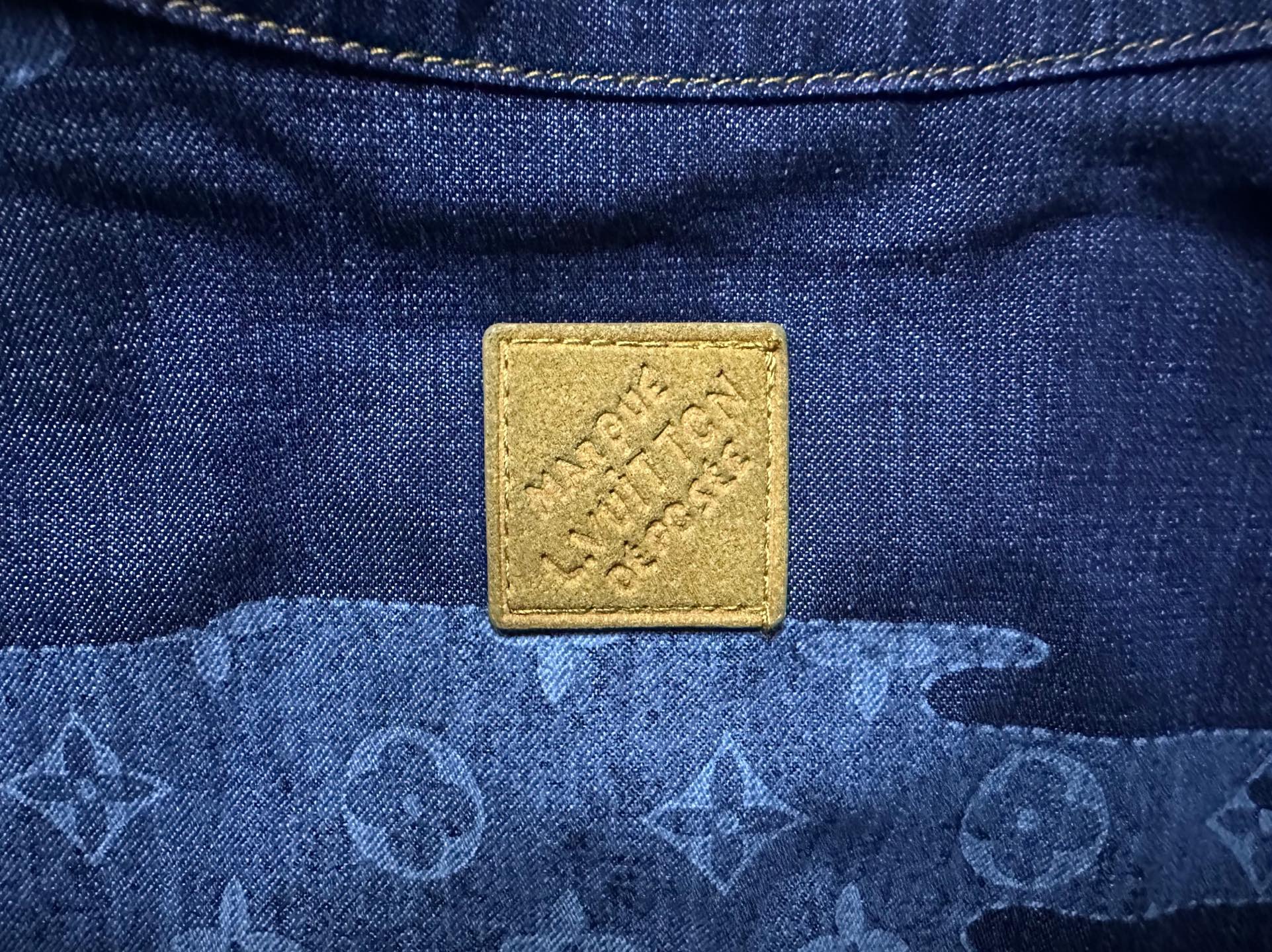 Louis Vuitton denim shirt square yellow brand patch on blue fabric