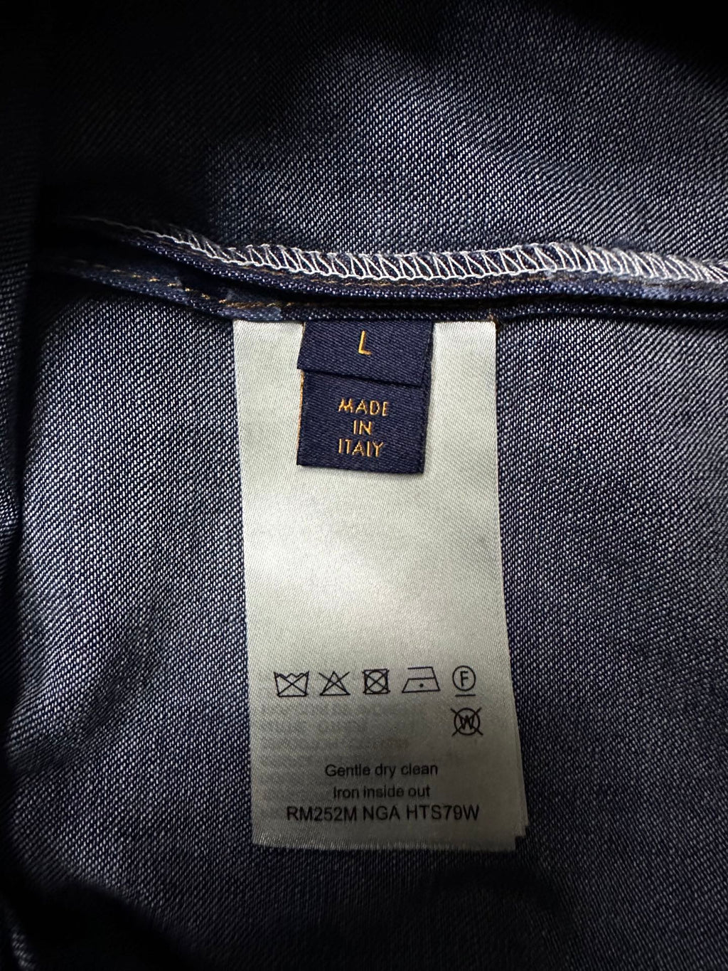 Louis Vuitton denim care label with Made in Italy and washing symbols on inside tag