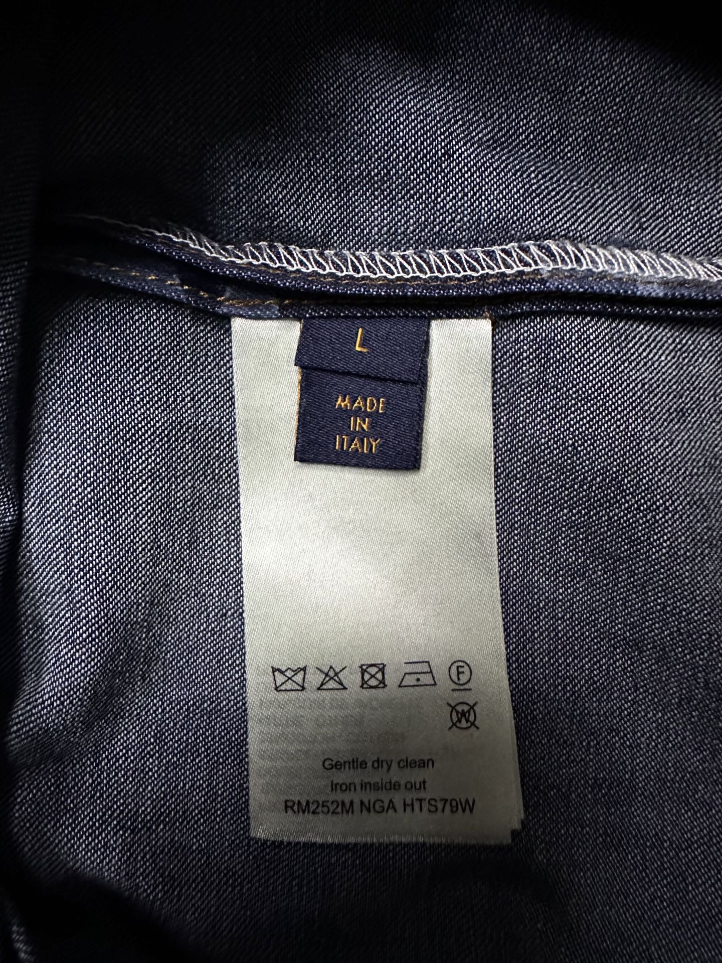 Louis Vuitton denim care label with Made in Italy and washing symbols on inside tag