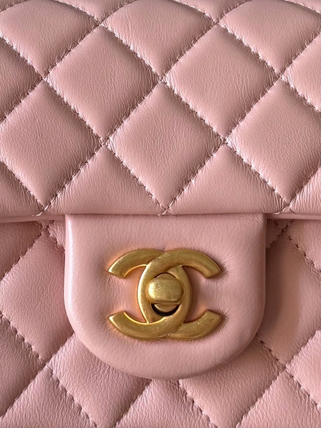 Chanel quilted pink bag flap with gold-tone CC logo