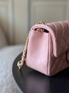 Chanel quilted pink leather bag with top handle and gold-tone chain