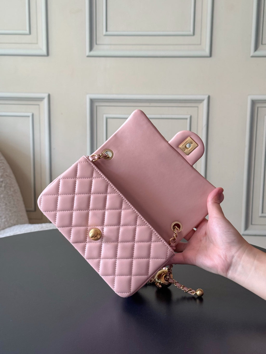Chanel pink quilted clutch with gold-tone clasp and chain strap