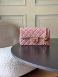 Chanel quilted pink shoulder bag with gold-tone logo and chain strap