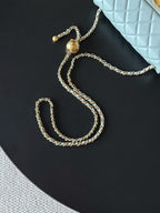Gold-tone chain strap with Chanel bag charm and connector