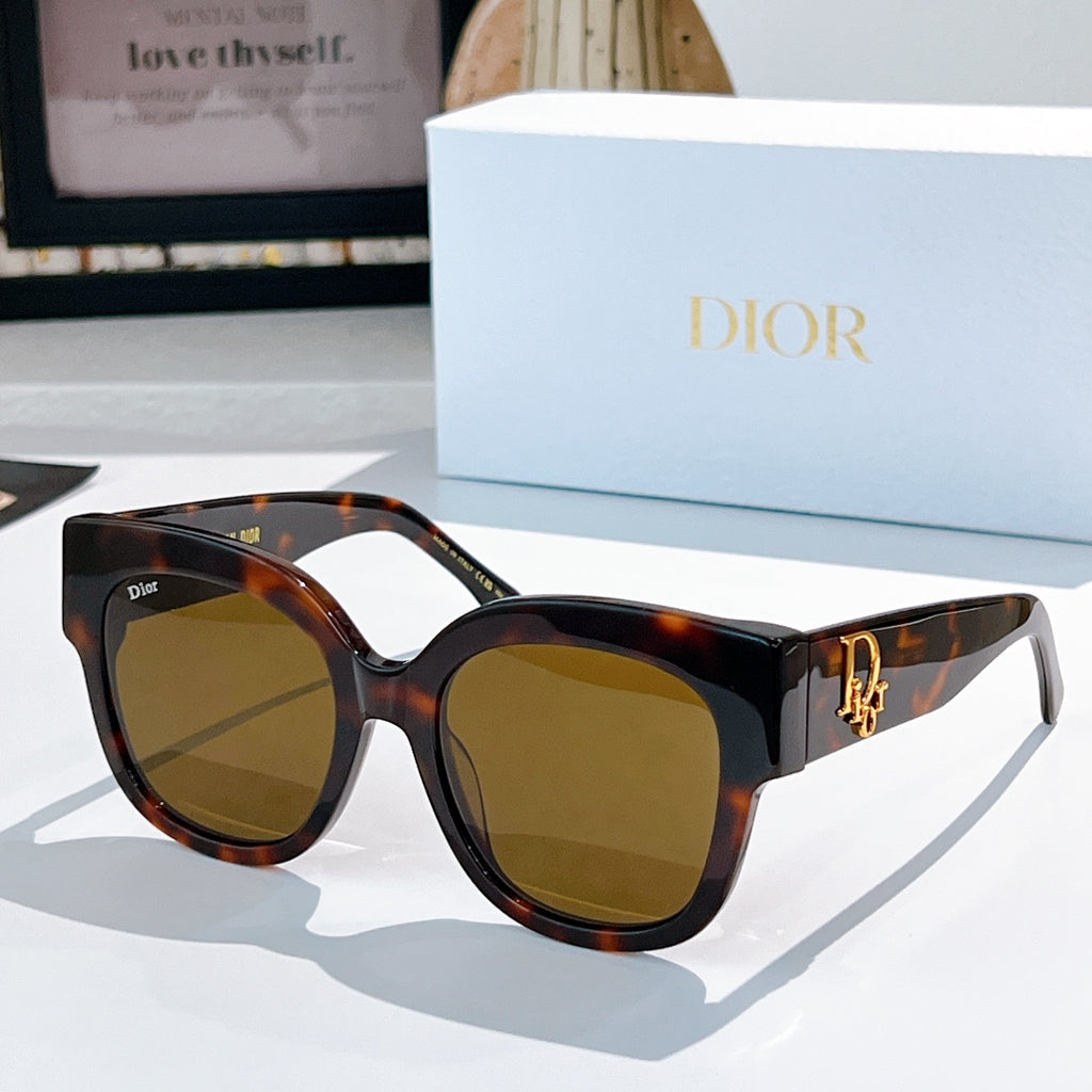 Tortoise acetate sunglasses with rounded cat-eye frames and brown tinted lenses, Dior detail