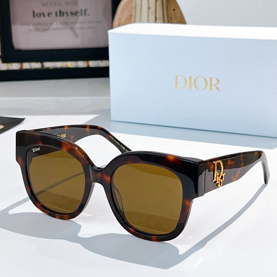 Tortoise acetate sunglasses with rounded cat-eye frames and brown tinted lenses, Dior detail
