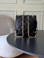 Chanel quilted mini bag, black with gold chain shoulder straps and CC accents