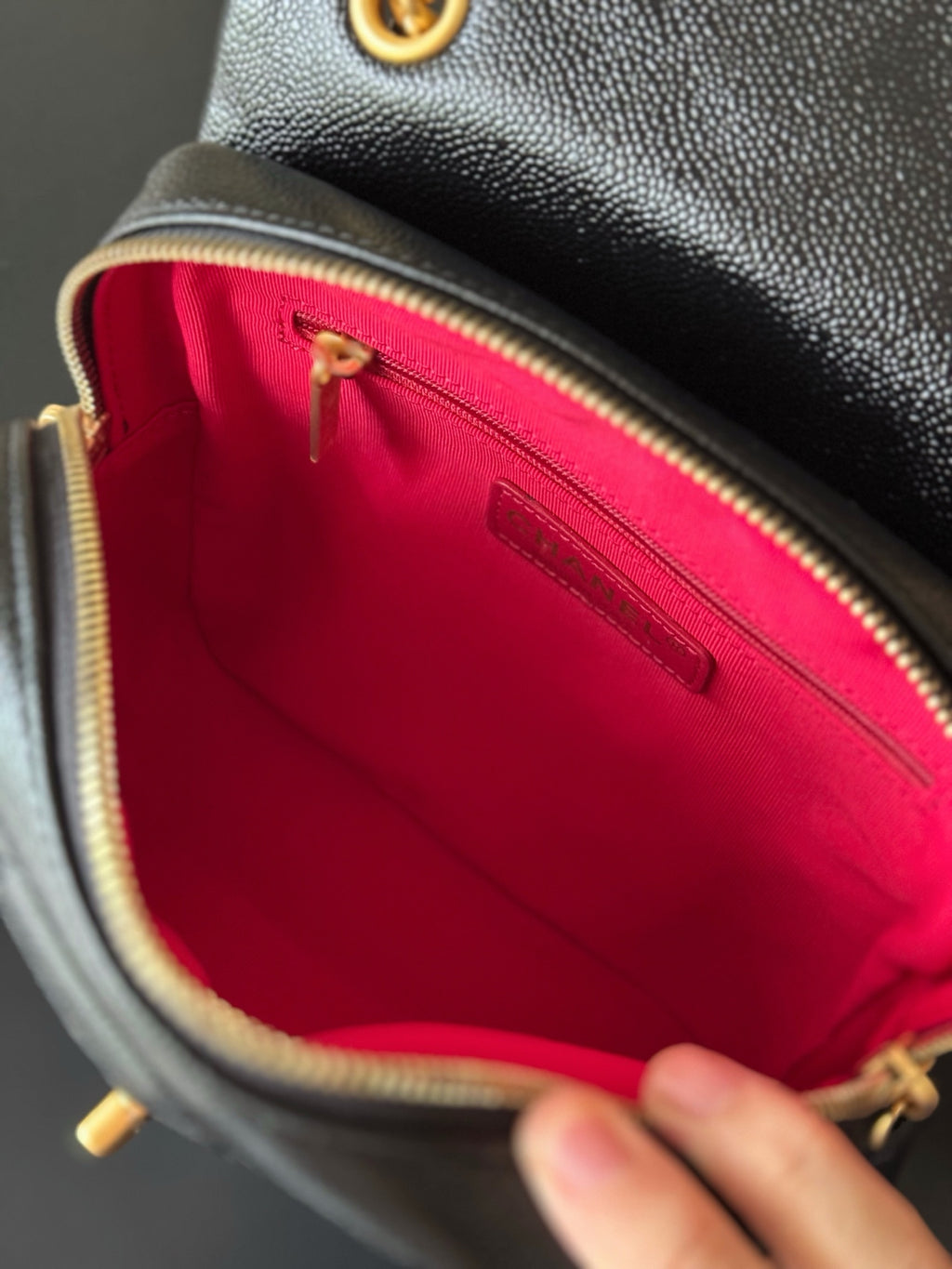 Chanel mini bag interior, pink fabric lining with zipper compartment and tag