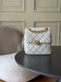 Chanel quilted bag in white with gold chain strap and front flap closure