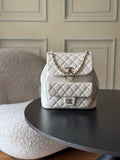 Chanel quilted white shoulder bag with chain strap and front logo clasp.